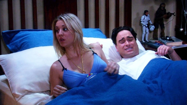 Penny yelling with the ring on a necklace and Leonard in bed on The Big Bang Theory