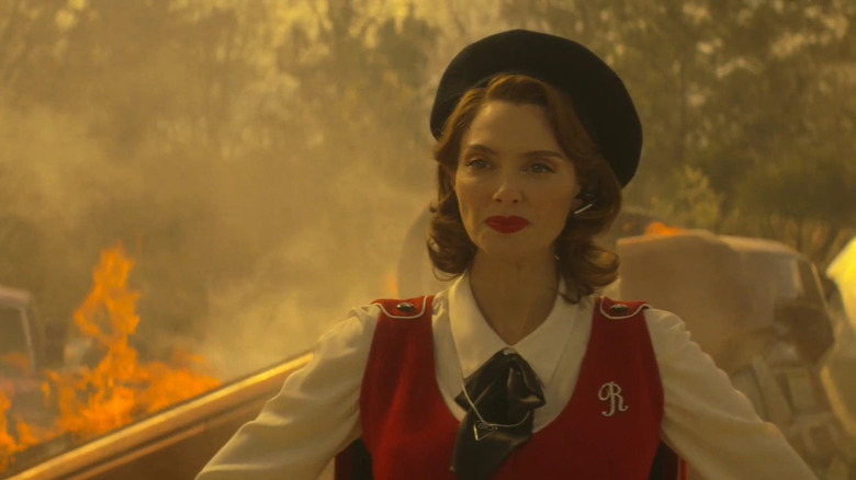 Rita Farr amid smoke