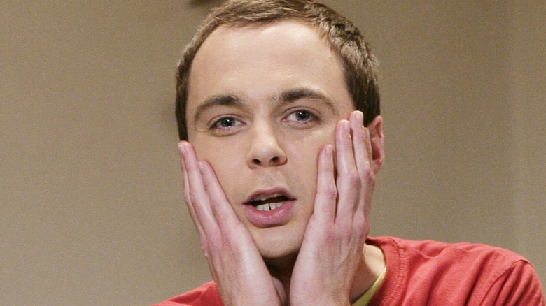 Sheldon brings his hands to his face