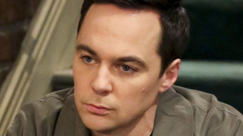 Sheldon Cooper sad and sitting on steps