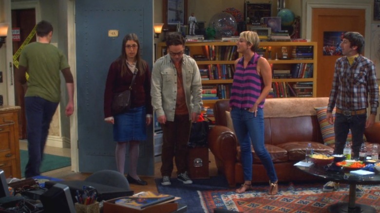 Sheldon walking out of apartment