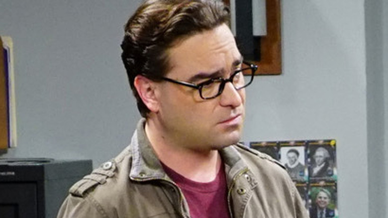 Leonard stands in Barry Kripke's office