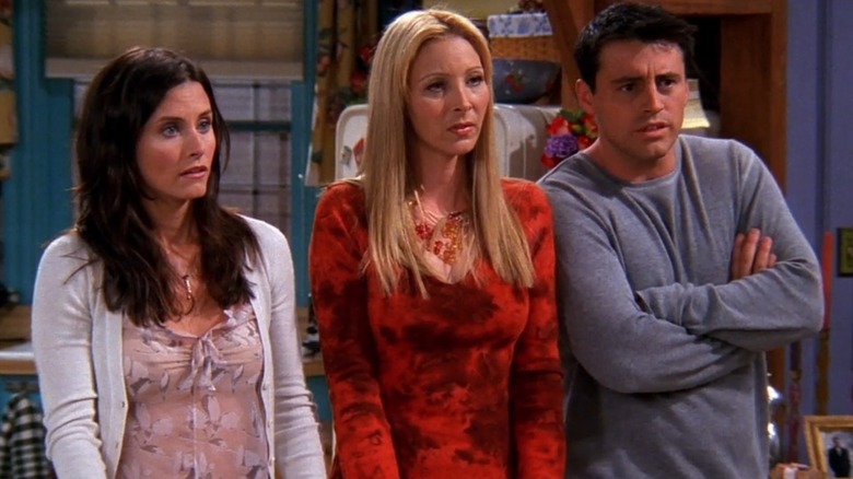 Monica, Phoebe, and Joey looking concerned