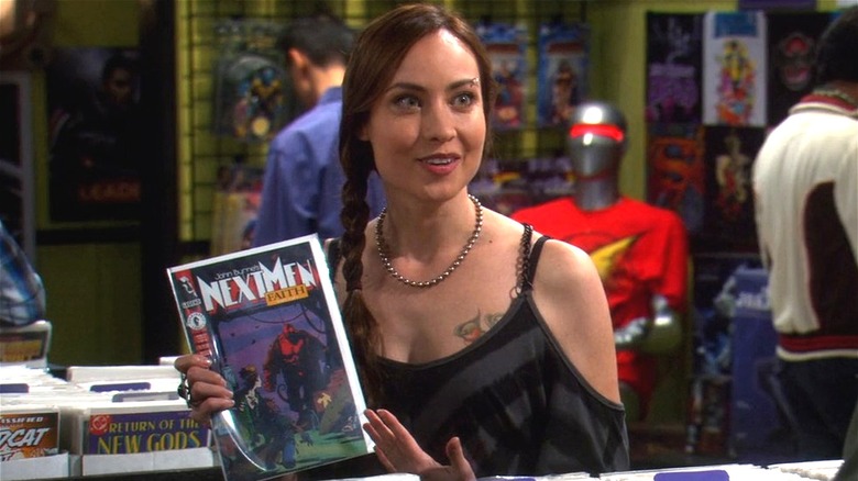 Alice holding a Next Men comic