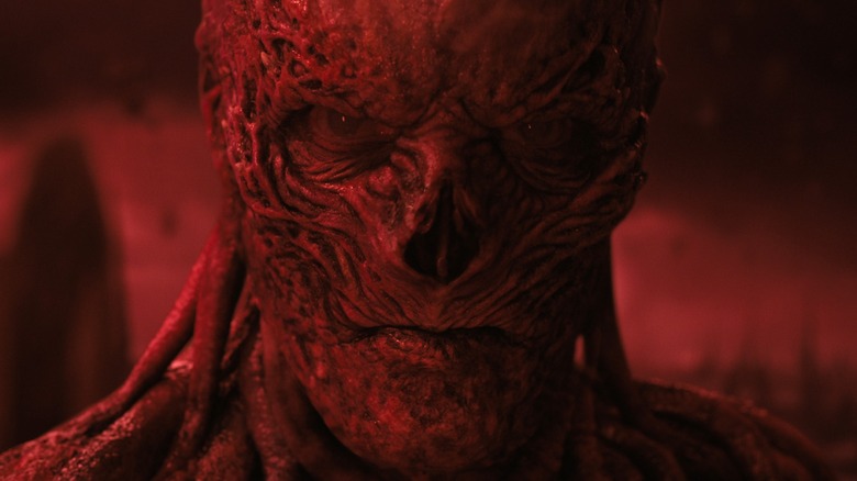 Vecna framed in the red Upside Down in Stranger Things Season 4