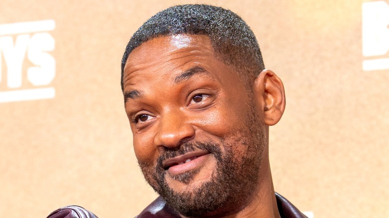 Will Smith smiling with beige background