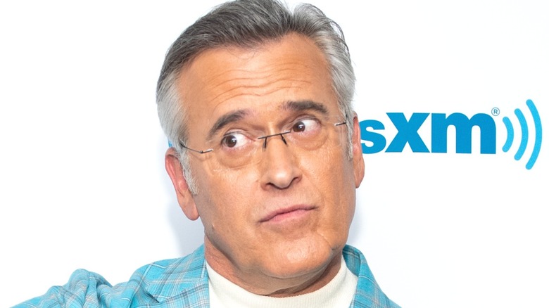 Bruce Campbell in front of a white background