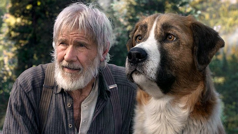 Harrison Ford as John Thornton with Buck in The Call of the Wild