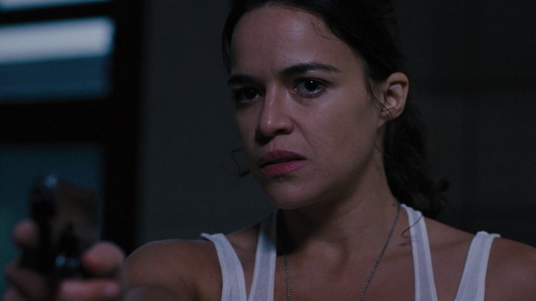 Letty Ortiz aims pistol