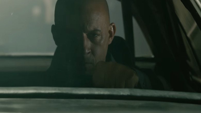 Dom behind steering wheel