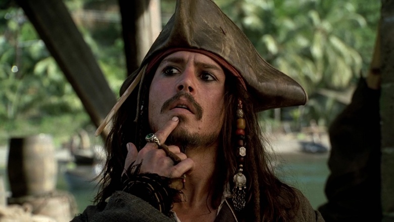 In Pirates of the Caribbean: Dead Man's Chest (2006), Jack Sparrow has red  and green beads in his beard braids, and red and green rings on his left  and right index fingers,