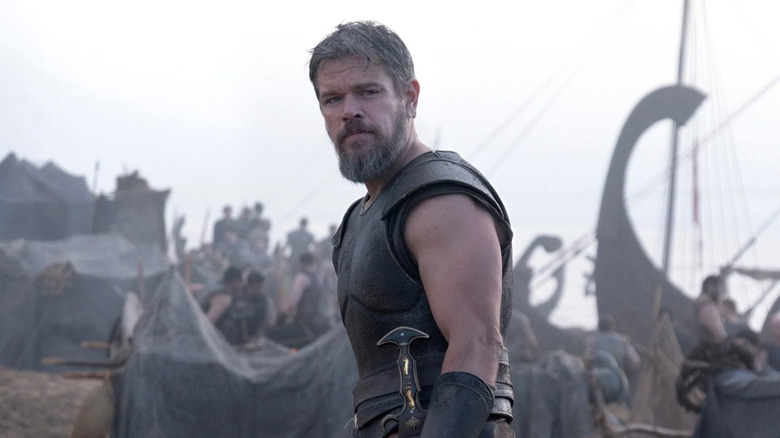 Odysseus standing in front of ships in "The Odyssey" (2026)