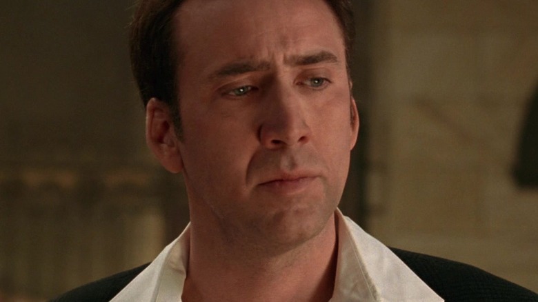 Nicolas Cage looks intently