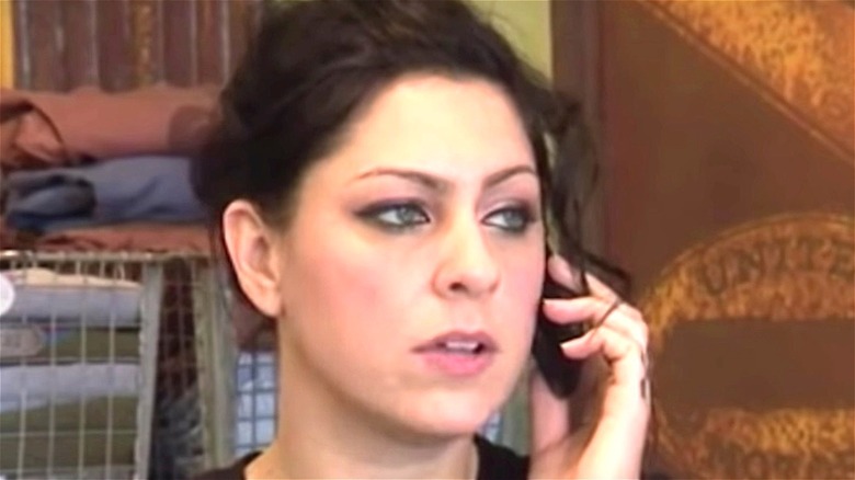 Danielle Colby talks on phone