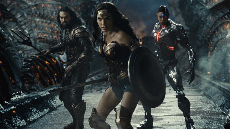 Aquaman, Wonder Woman, and Cyborg in a fighting pose