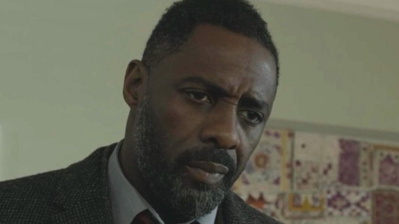 Idris Elba as Luther looking down