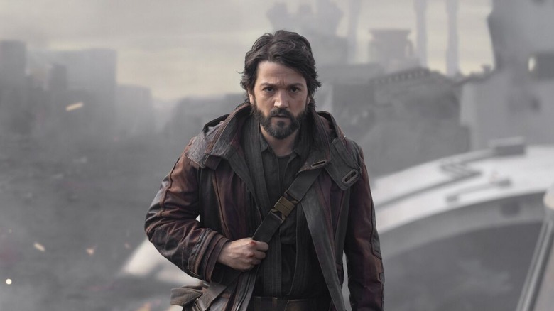 Cassian clutches strap and walks