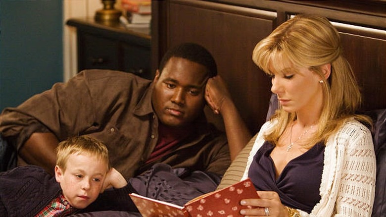 Sandra Bullock reading a book