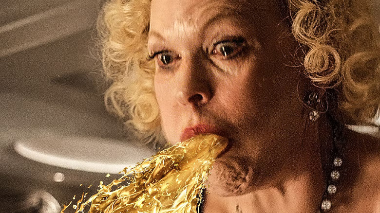 Old rich woman vomits on a ship