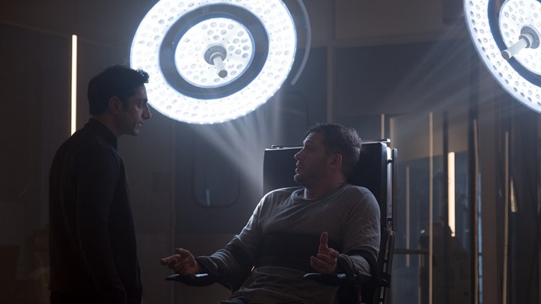 Riz Ahmed as Carlton Drake and Tom Hardy as Eddie Brock in Venom