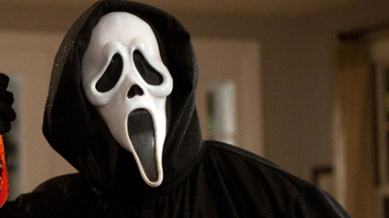 Ghostface wielding a bloody knife