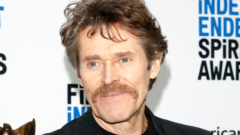 Willem Dafoe smiling