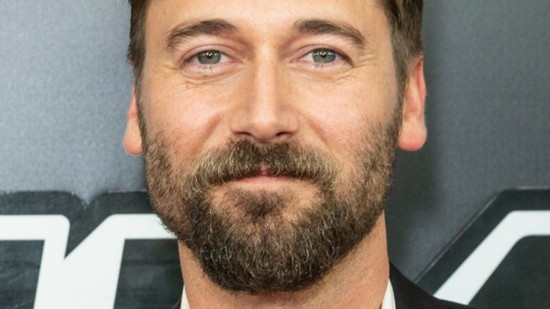 Ryan Eggold smiling 