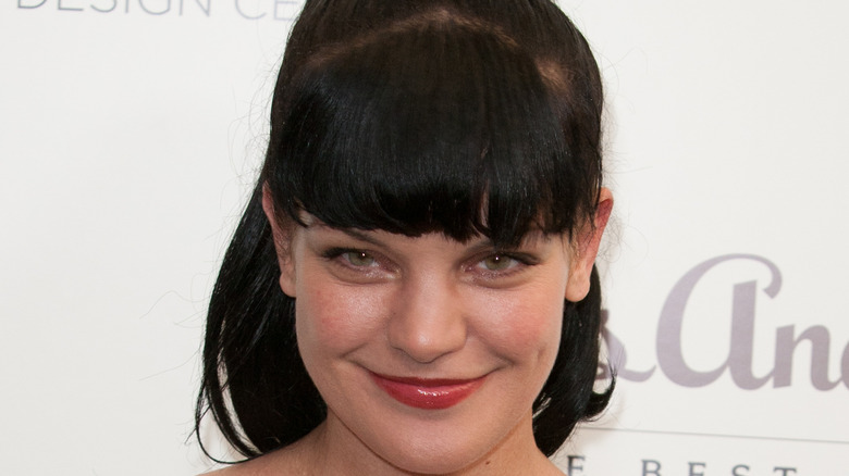 Pauley Perrette posing at an event