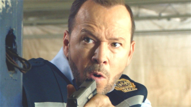 Donnie Wahlberg pointing gun