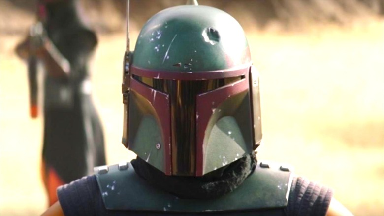 Boba Fett wearing his dented helmet