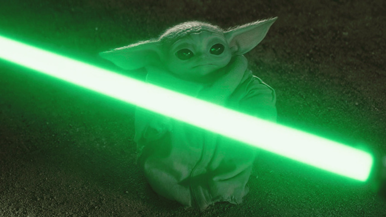 Grogu seeing Yoda's lightsaber