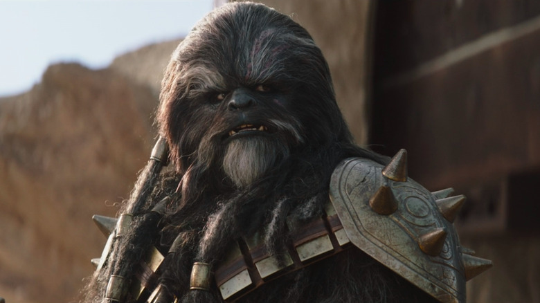 Krrsantan looking at Boba Fett