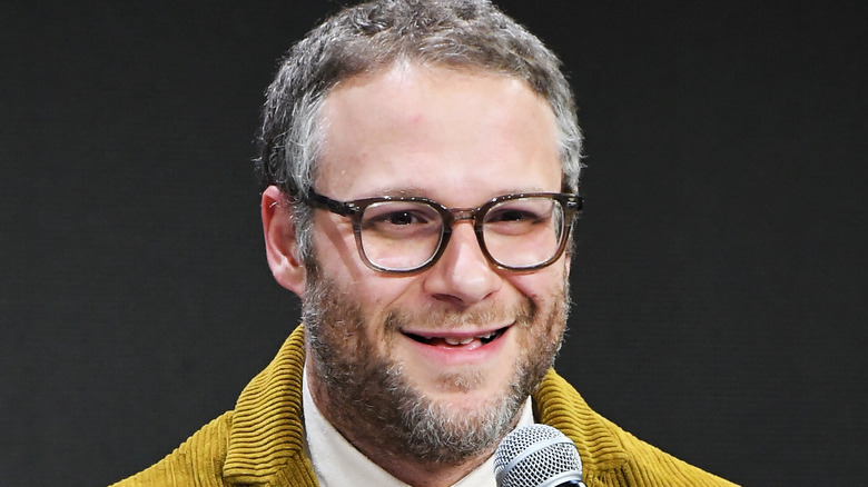 Seth Rogen speaking into a mic