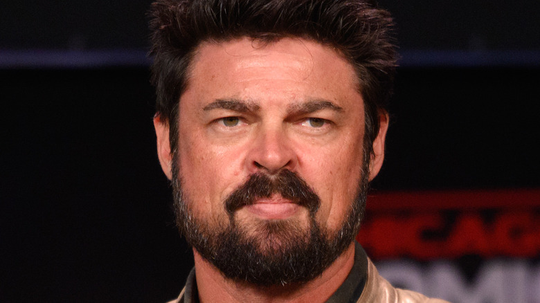 Karl Urban scowling with a beard