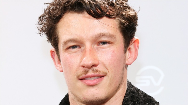 Callum Turner with small mustache