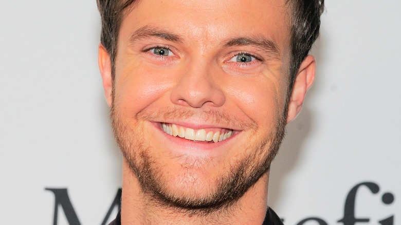 Jack Quaid beams at a premiere