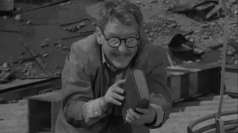 Henry Bemis admiring a book on The Twilight Zone