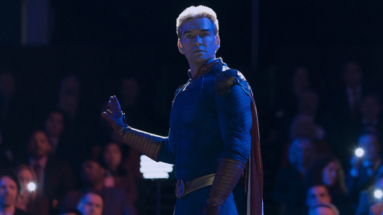 Homelander standing on a stage and looking stunned on The Boys