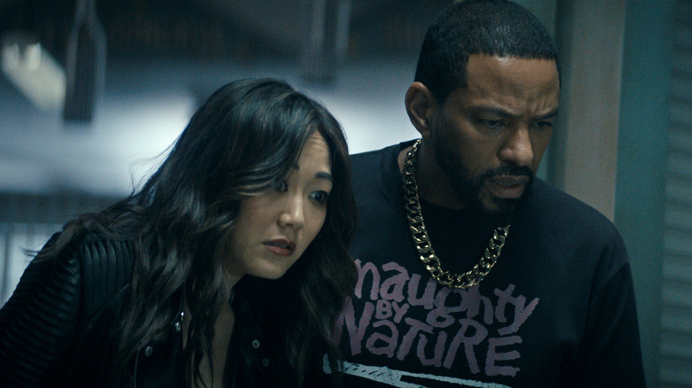 Kimiko and Mother's Milk look down with concern in "The Boys" (2019-2026)