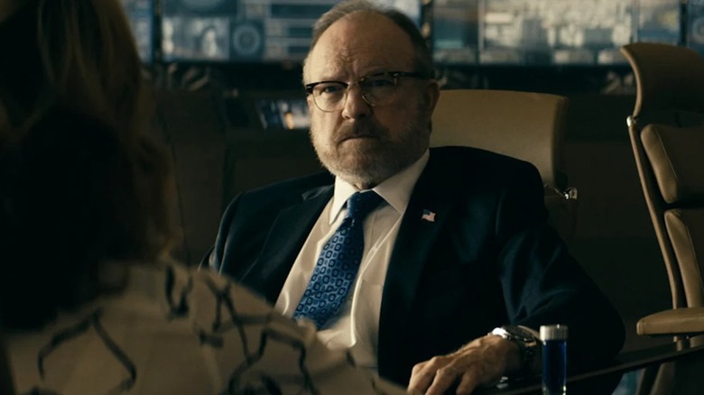 Robert Singer sitting in Vought Tower in "The Boys" (2019-2026)
