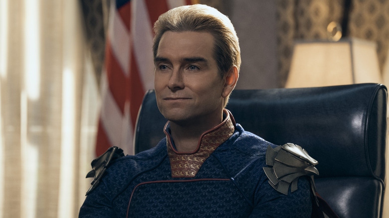 Homelander sitting at a desk in 
