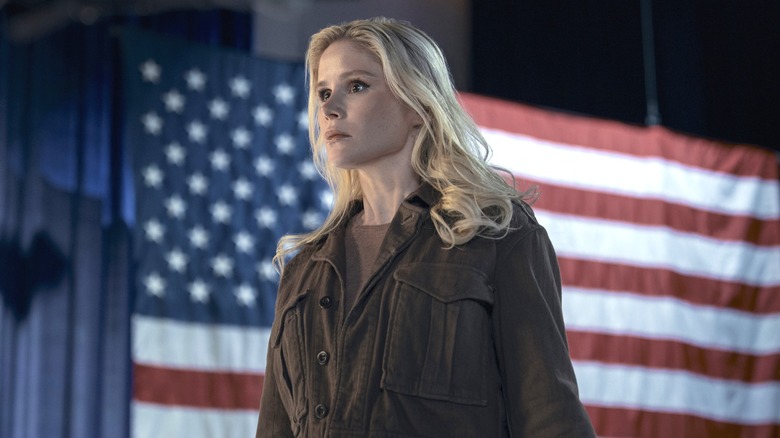 Annie frowning and standing in front of an American flag in "The Boys" (2019-2026)