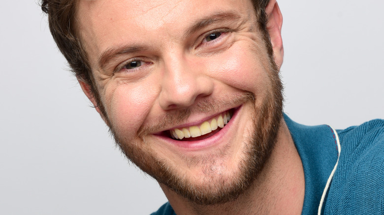 Jack Quaid smiling