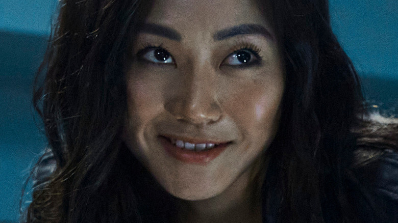 Karen Fukuhara smiling menacingly as Kimiko