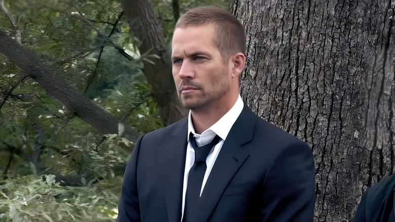 Brian O'Connor standing in front of a tree