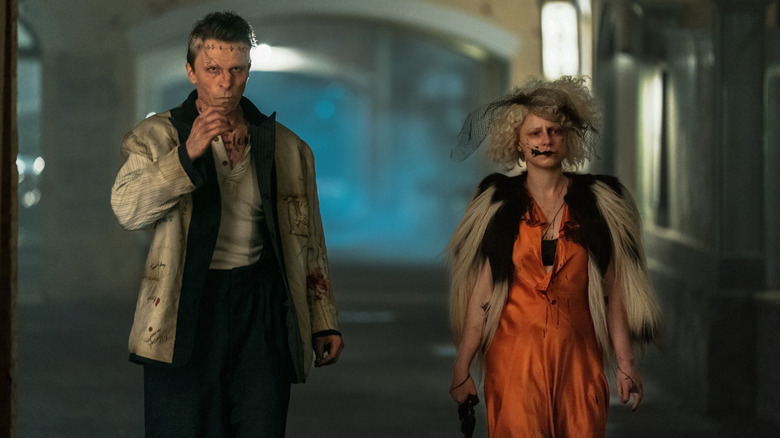 Frankenstein and The Bride walk down the street