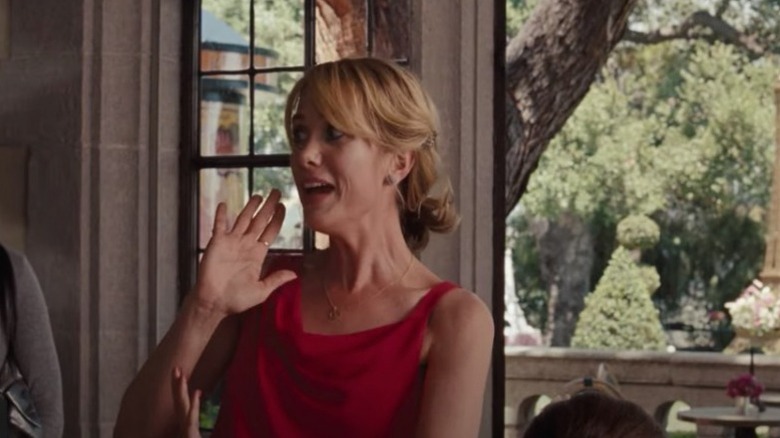 Bridesmaids Kristen Wiig screams in a red dress