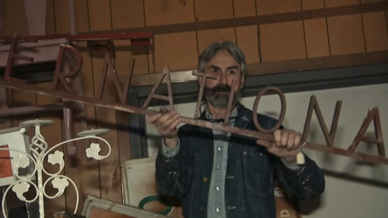 Mike holds the international sign