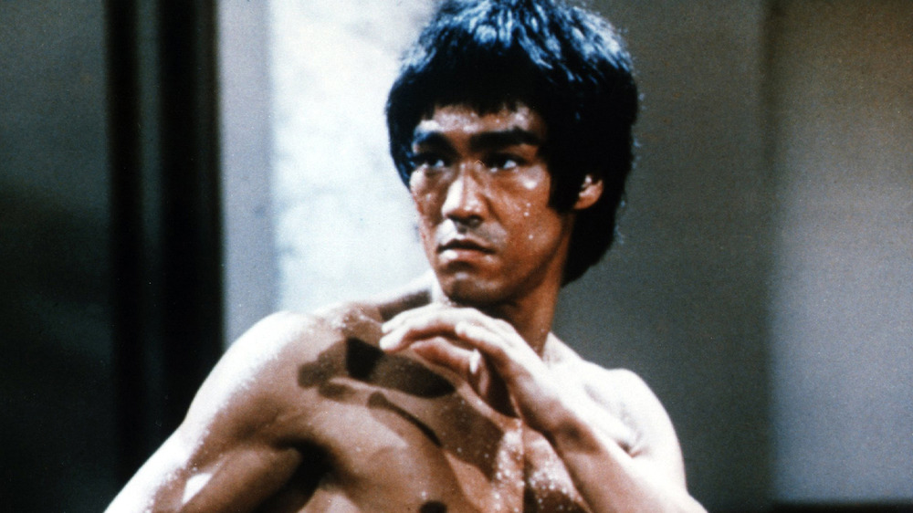 Bruce Lee takes fighting stance
