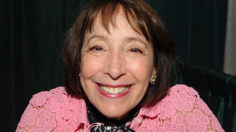 Didi Conn at an autograph table